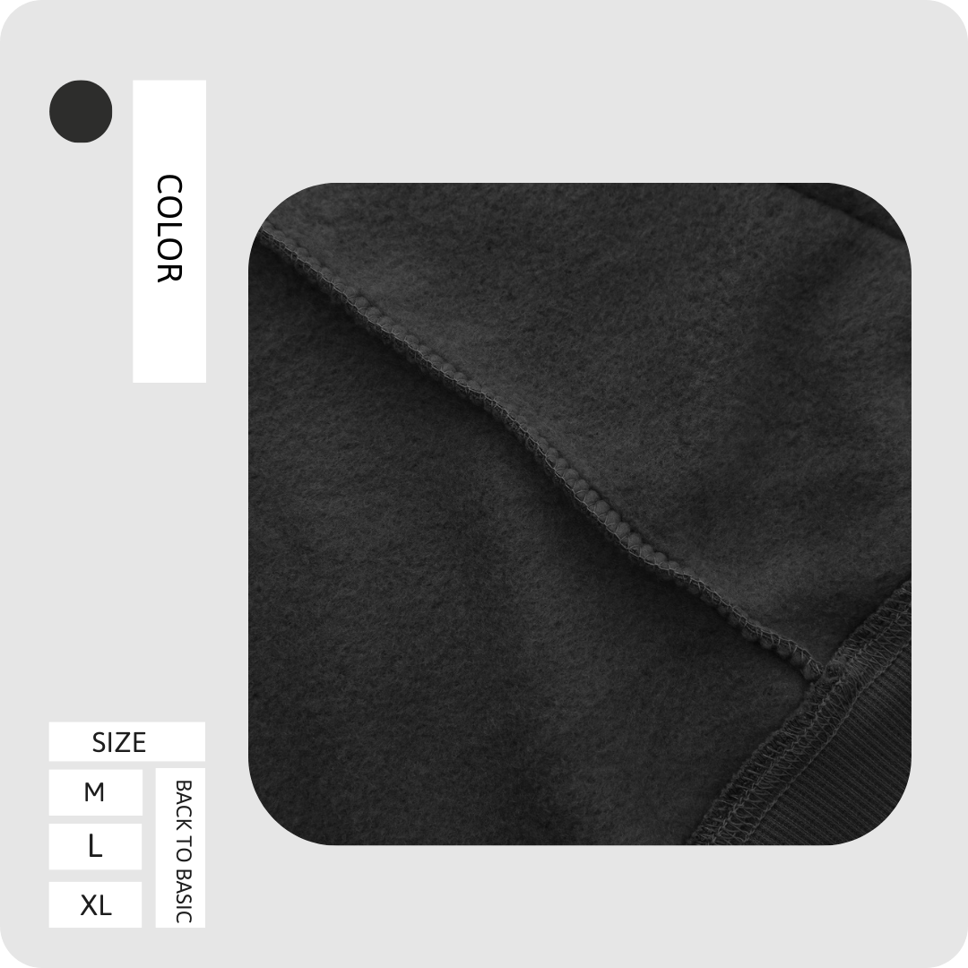 Black embroidered sweater fabric texture and ribbed trim detail close-up