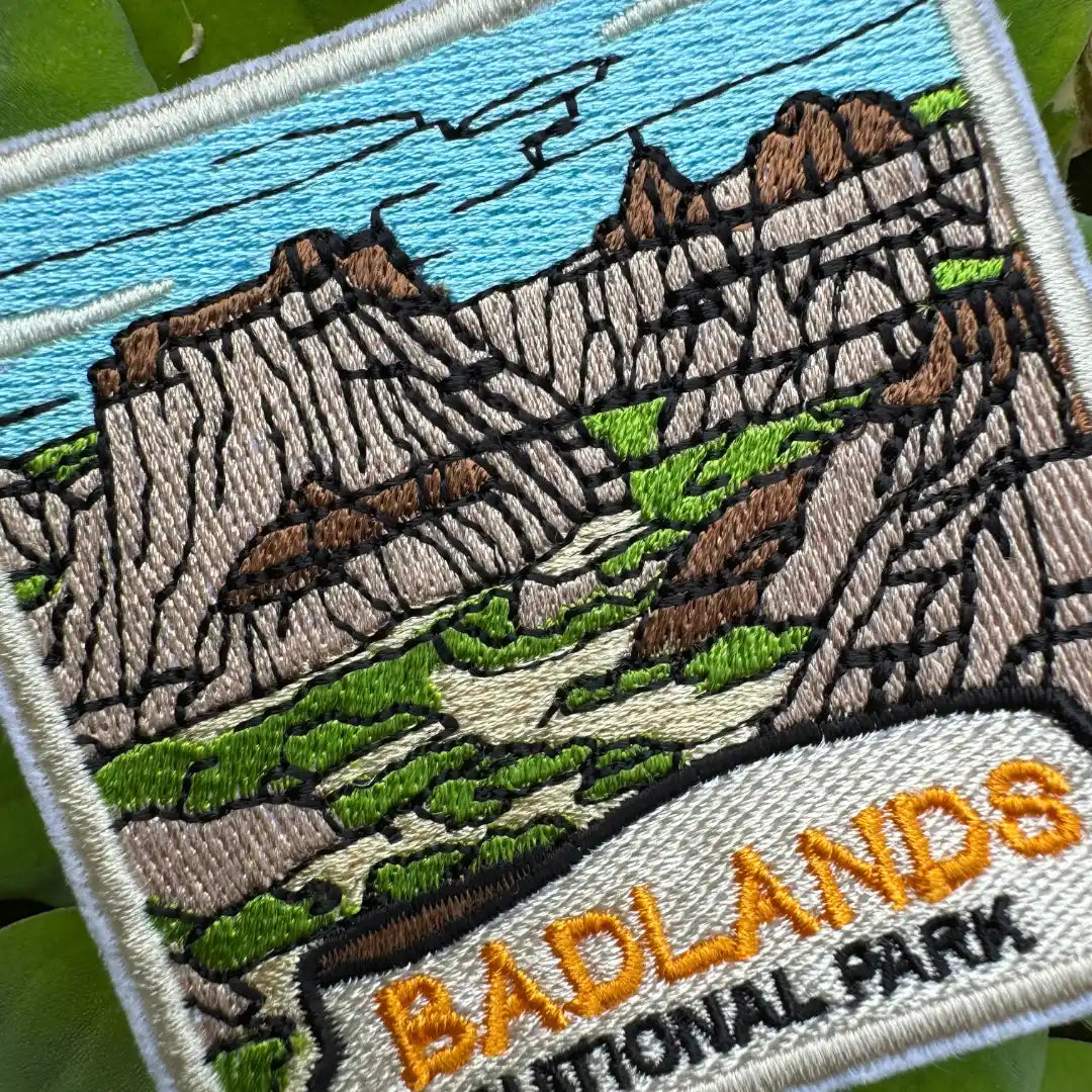 Iron-on travel patch showing South Dakota’s Badlands