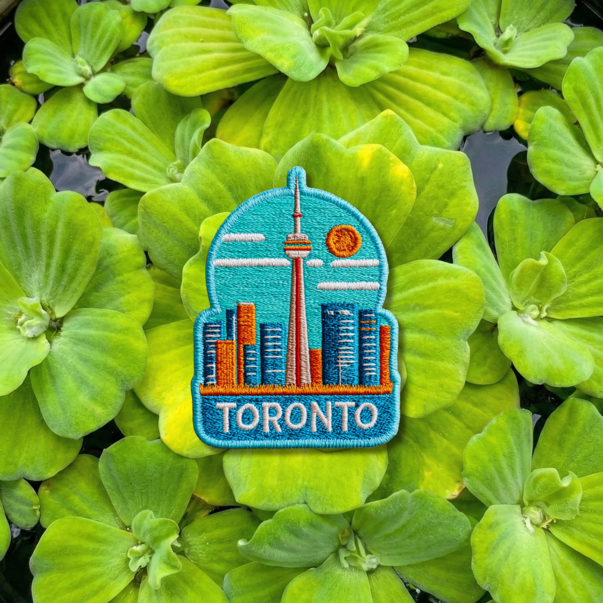Close-up detail of high-quality stitching on Toronto CN Tower embroidery patch