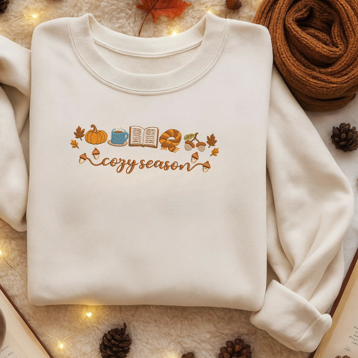 Cozy season embroidery with pumpkin and book