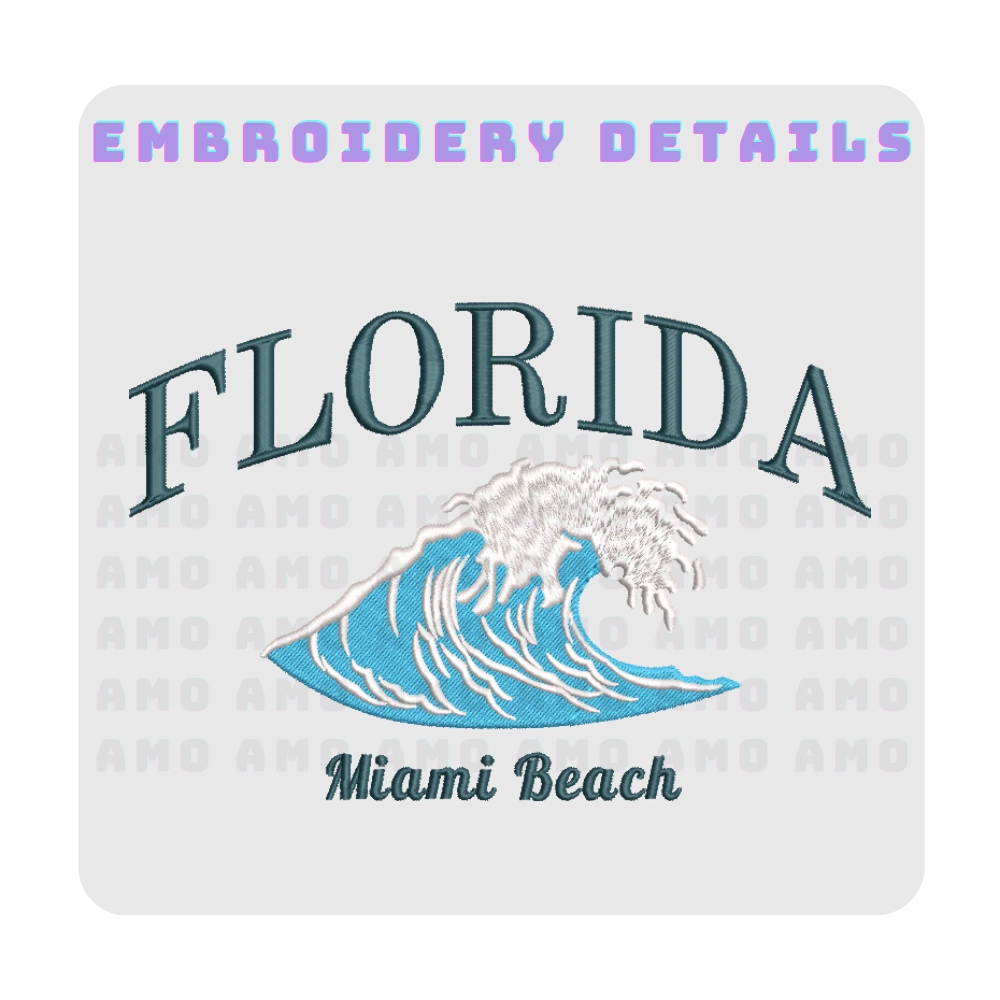 Model wearing Florida embroidered shirt by the beach