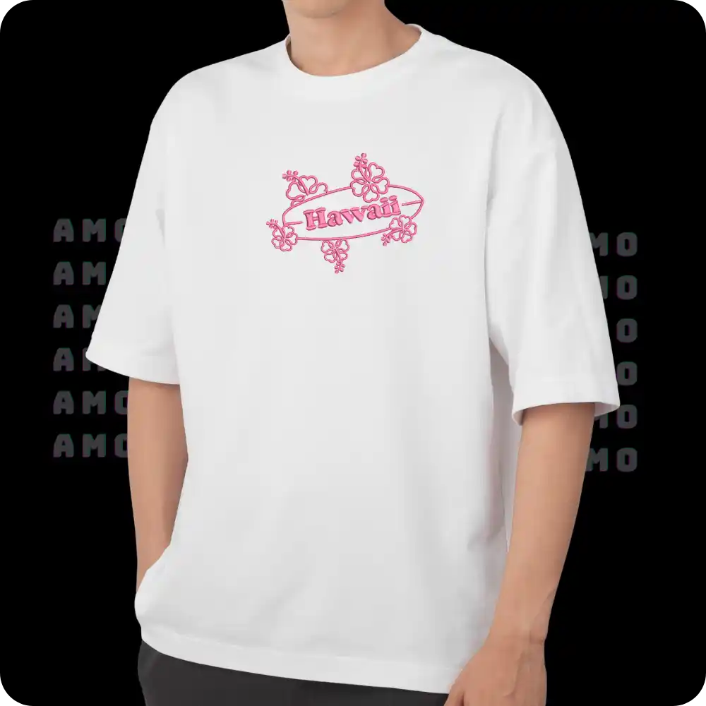 Model wearing Hawaii embroidered shirt by the beach