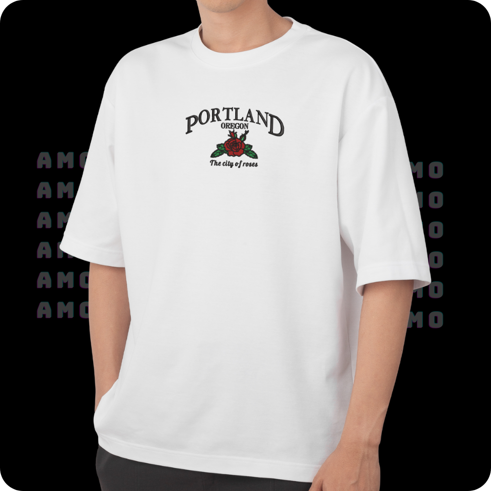 Model wearing Portland embroidered shirt in park