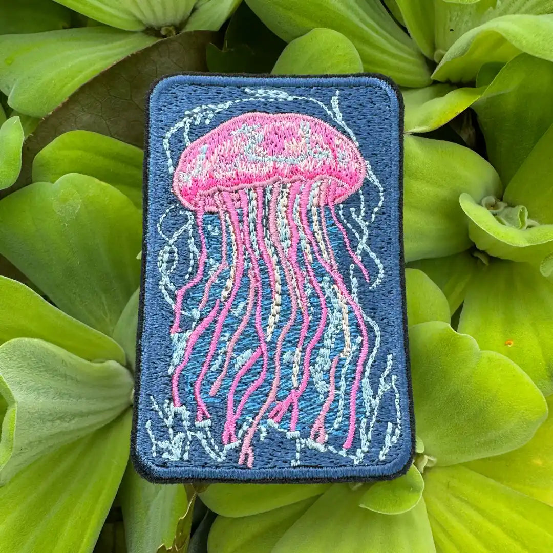 Whimsical marine jellyfish appliqué in pink and blue