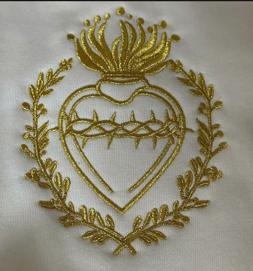 gold thread sacred heart design on white sweatshirt