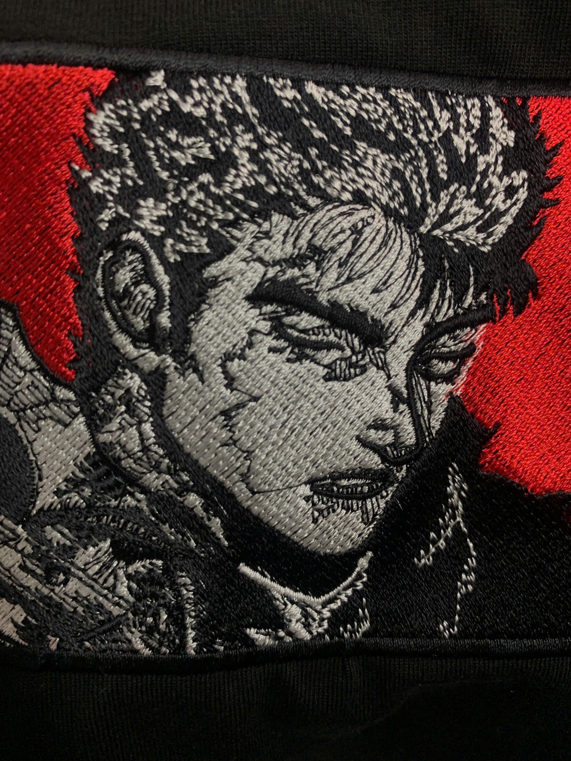 guts berserk embroidered patch flat lay