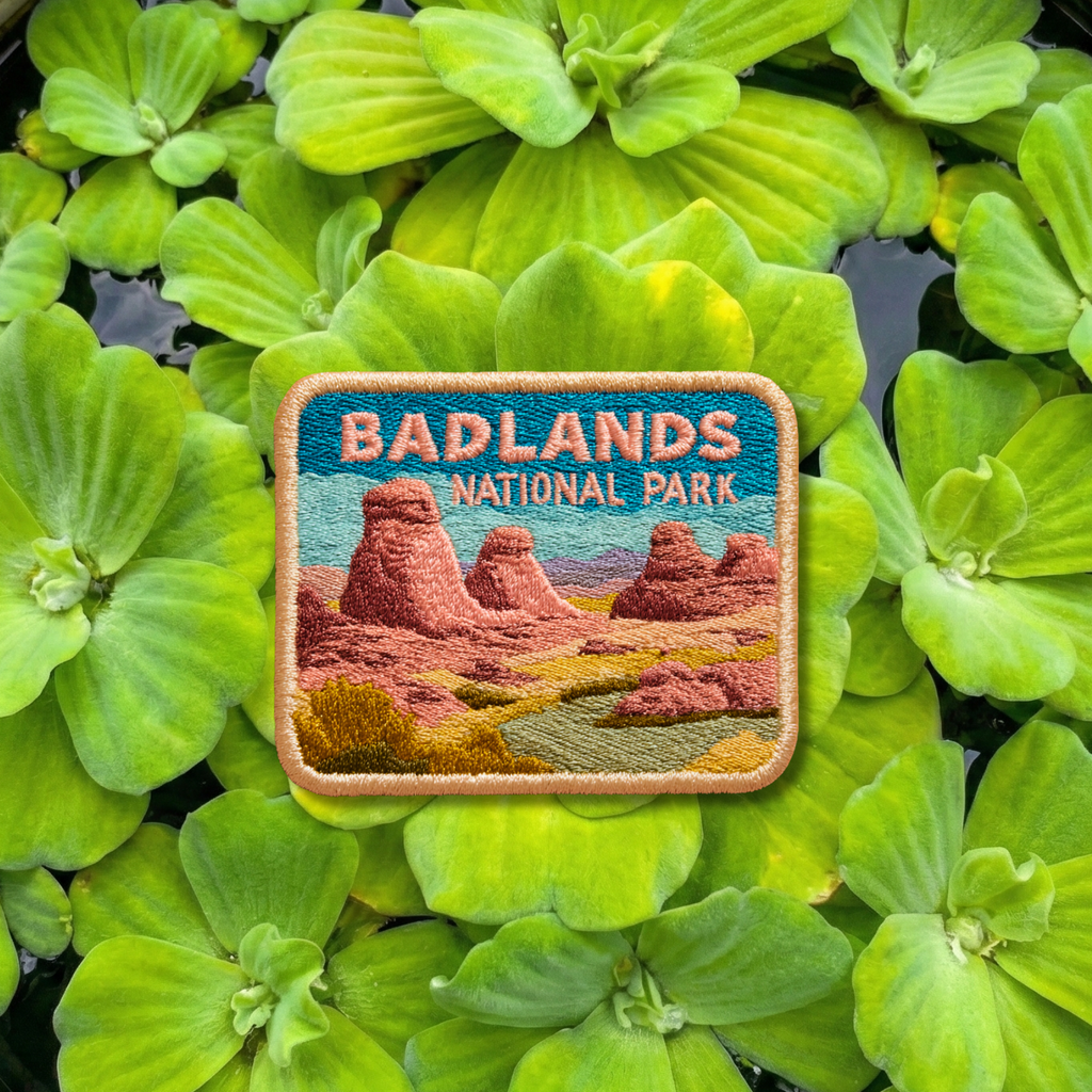 Badlands National Park embroidery patch featuring desert rock formations and open landscape
