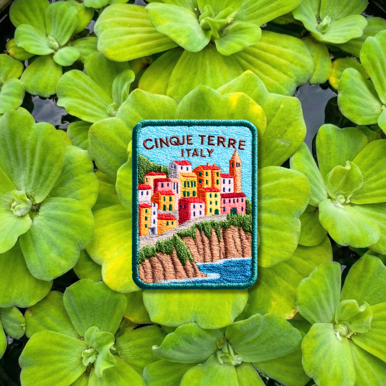 Cinque Terre Italy embroidery patch featuring colorful coastal villages and cliffs
