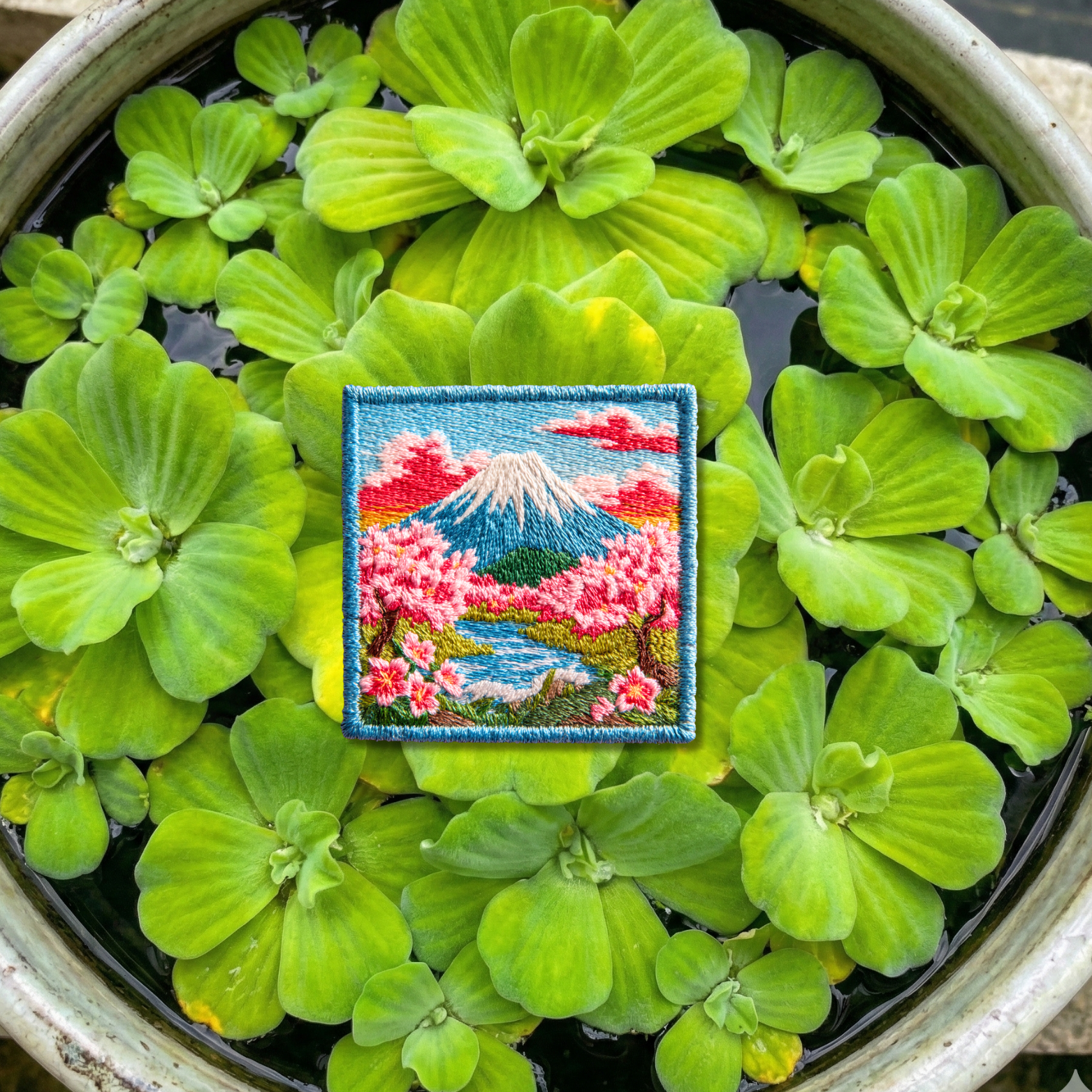 Close-up detail of high-quality stitching on Mount Fuji cherry blossom embroidery patch
