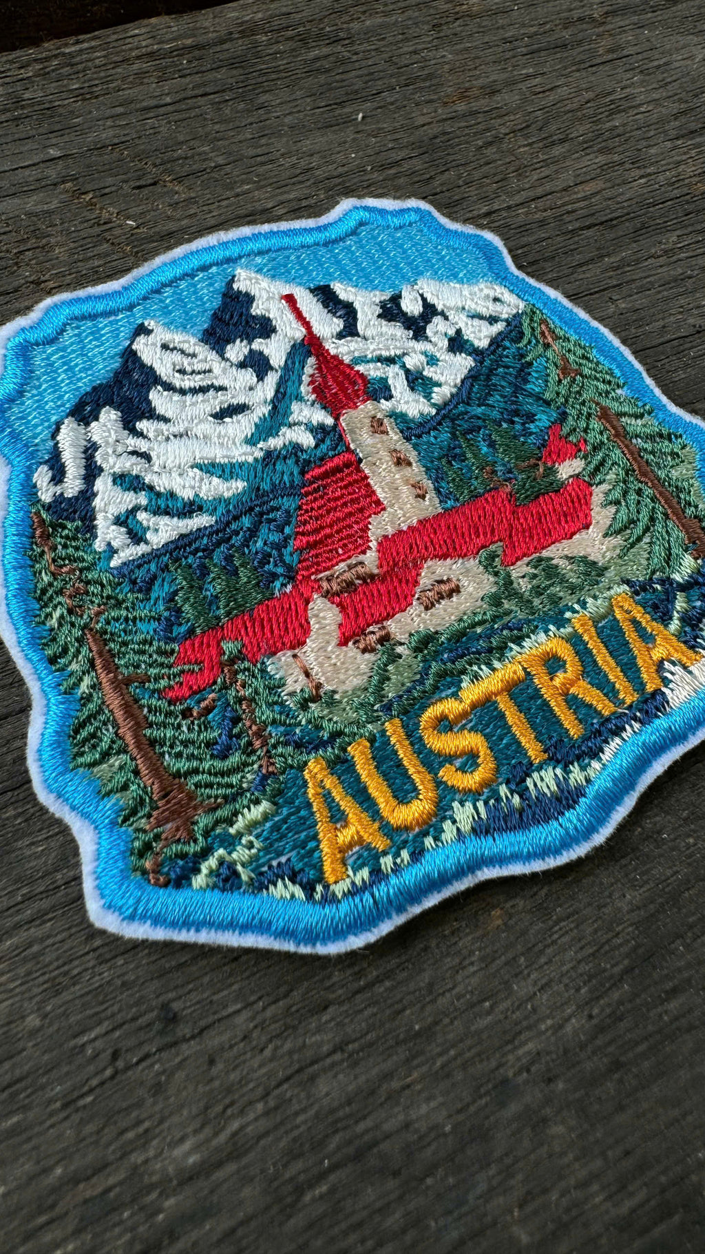 Close-up embroidery Austria alpine travel patch europe