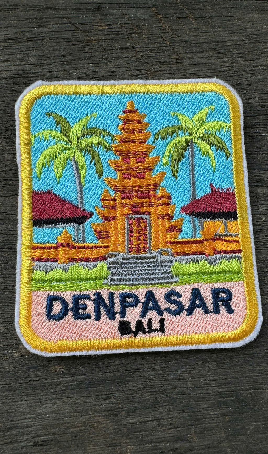 Close-up embroidery Bali travel patch palm trees tropical design