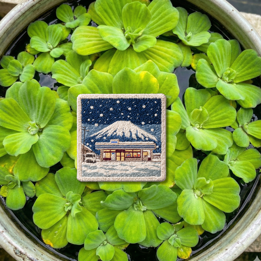 Close-up embroidery detail of Mount Fuji winter travel patch
