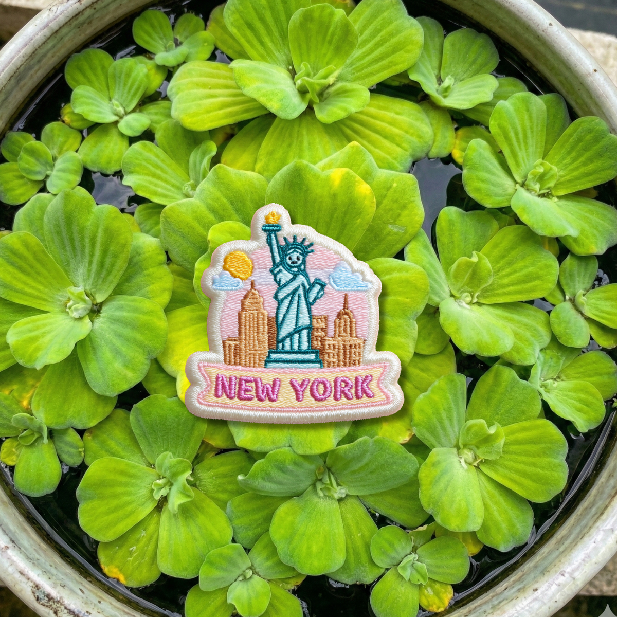 Close-up embroidery details of New York skyline patch
