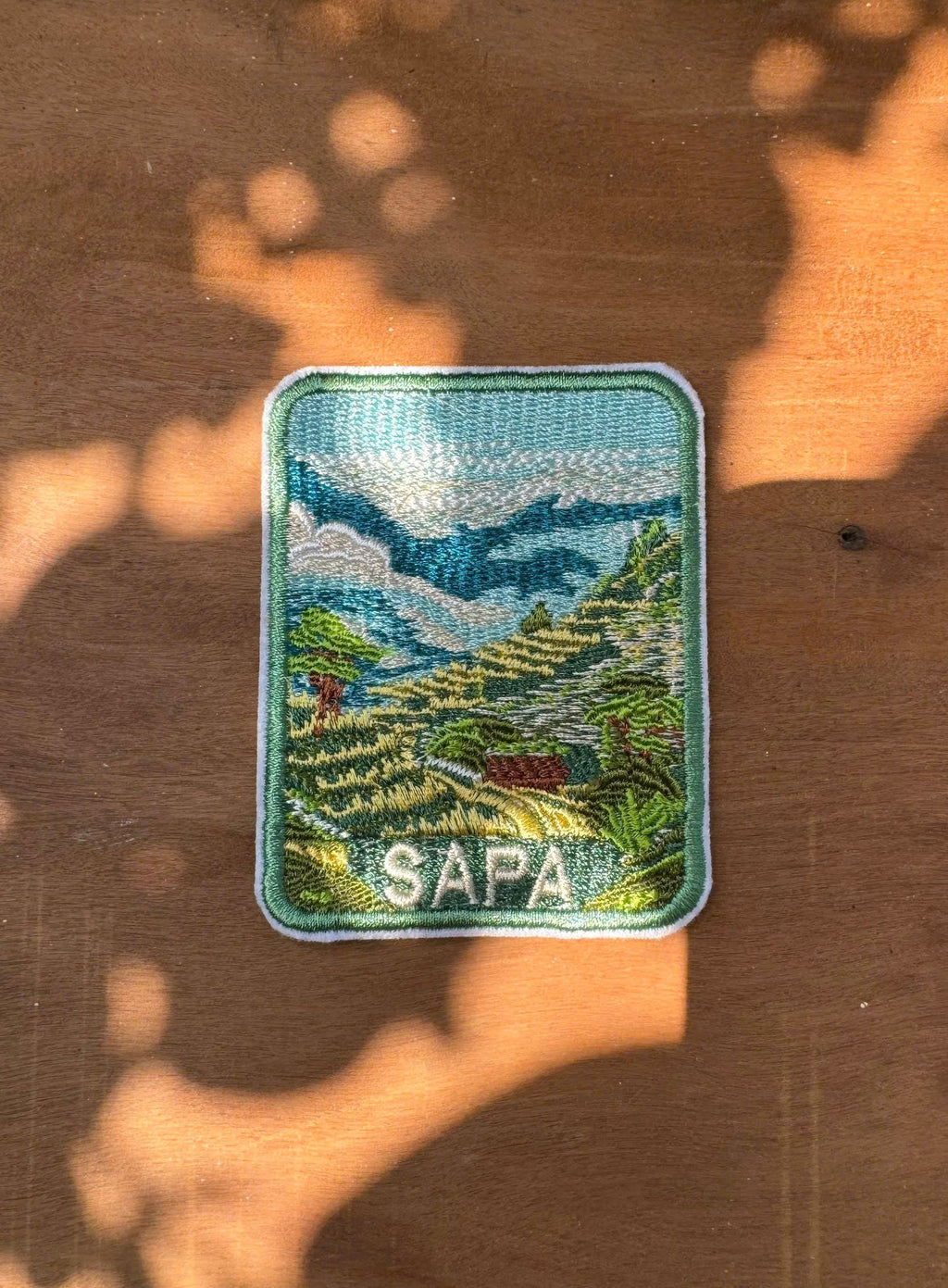 Close-up embroidery details of Sapa mountain travel patch Vietnam
