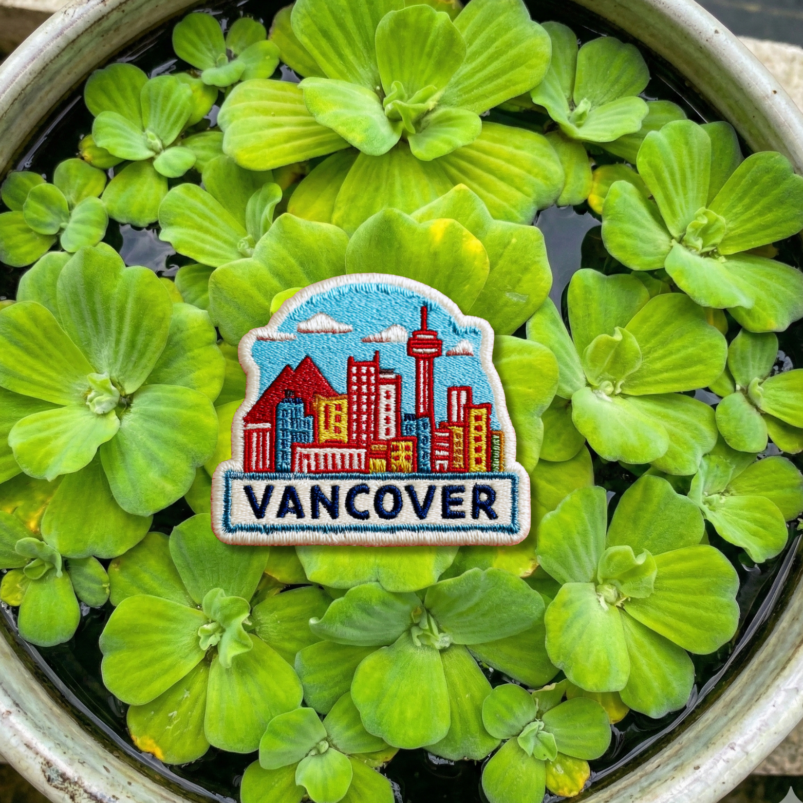 Close-up embroidery details of Vancouver city skyline patch
