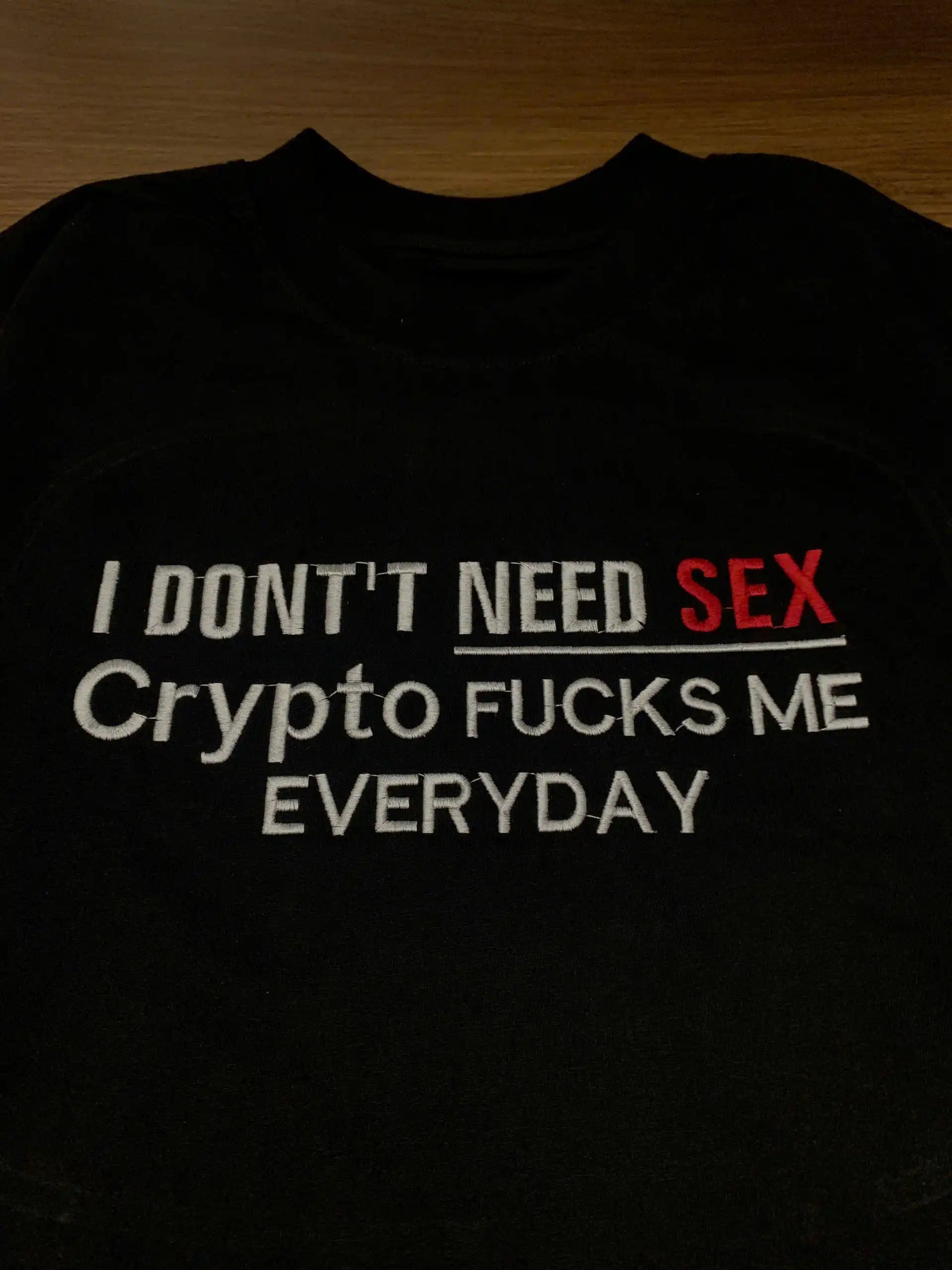 Close-up of "Crypto F*cks Me Everyday" embroidery  