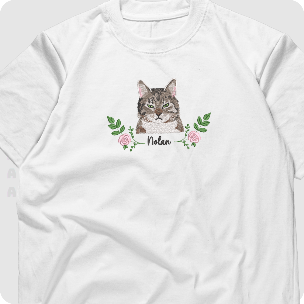 Close-up of pet embroidery on black t-shirt