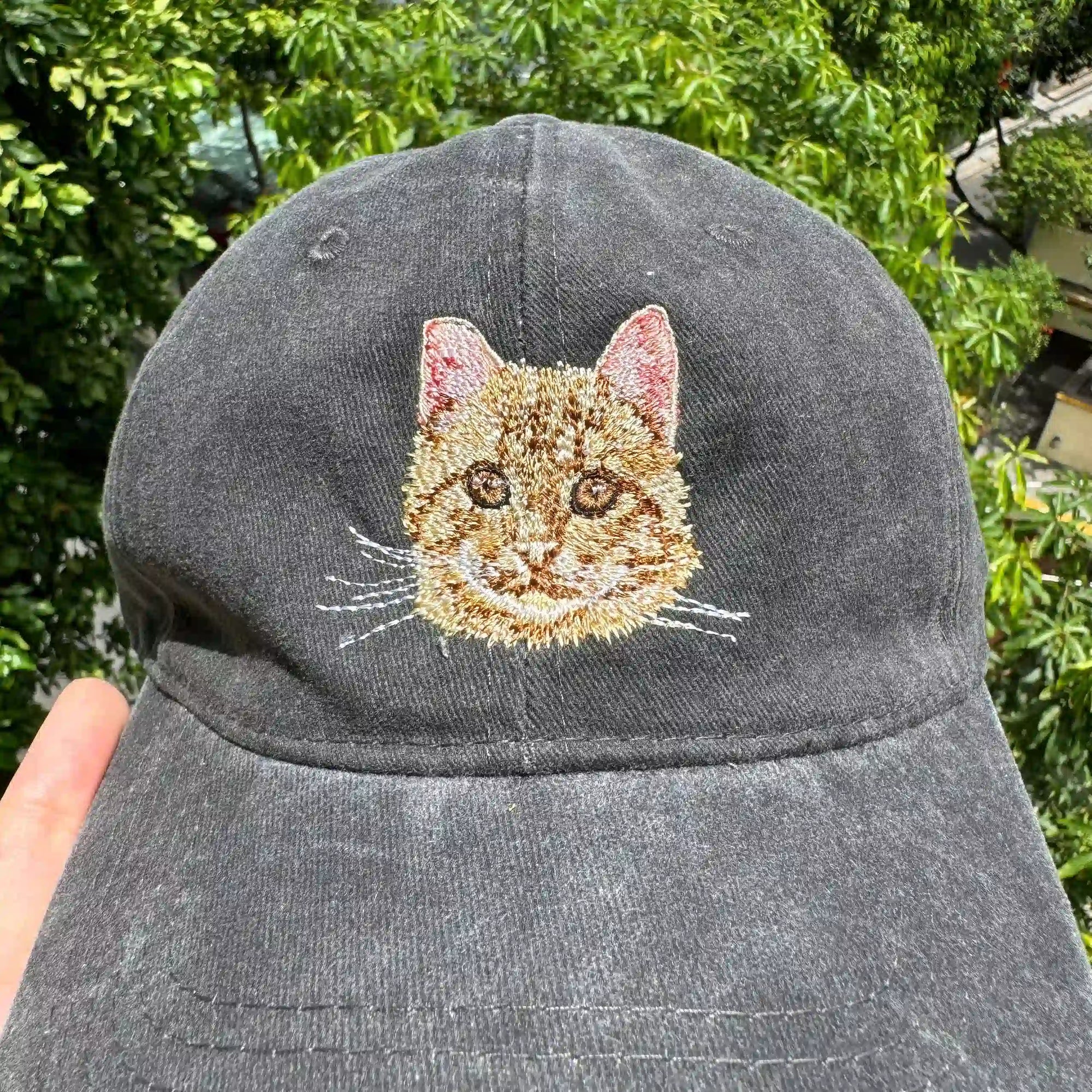 Close-up of realistic pet embroidery on adjustable dad hat