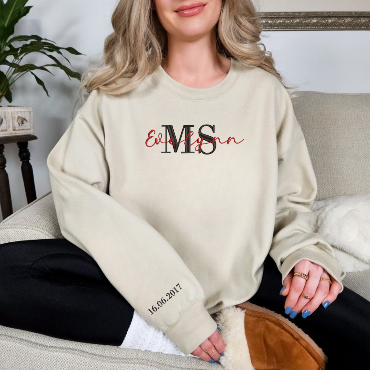 Custom Mrs embroidered sweatshirt folded neatly on bed