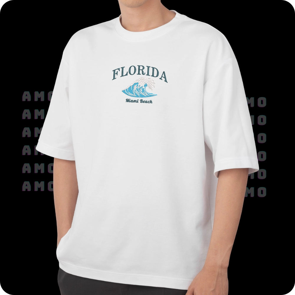 Folded Miami Beach city tee showing embroidery  
