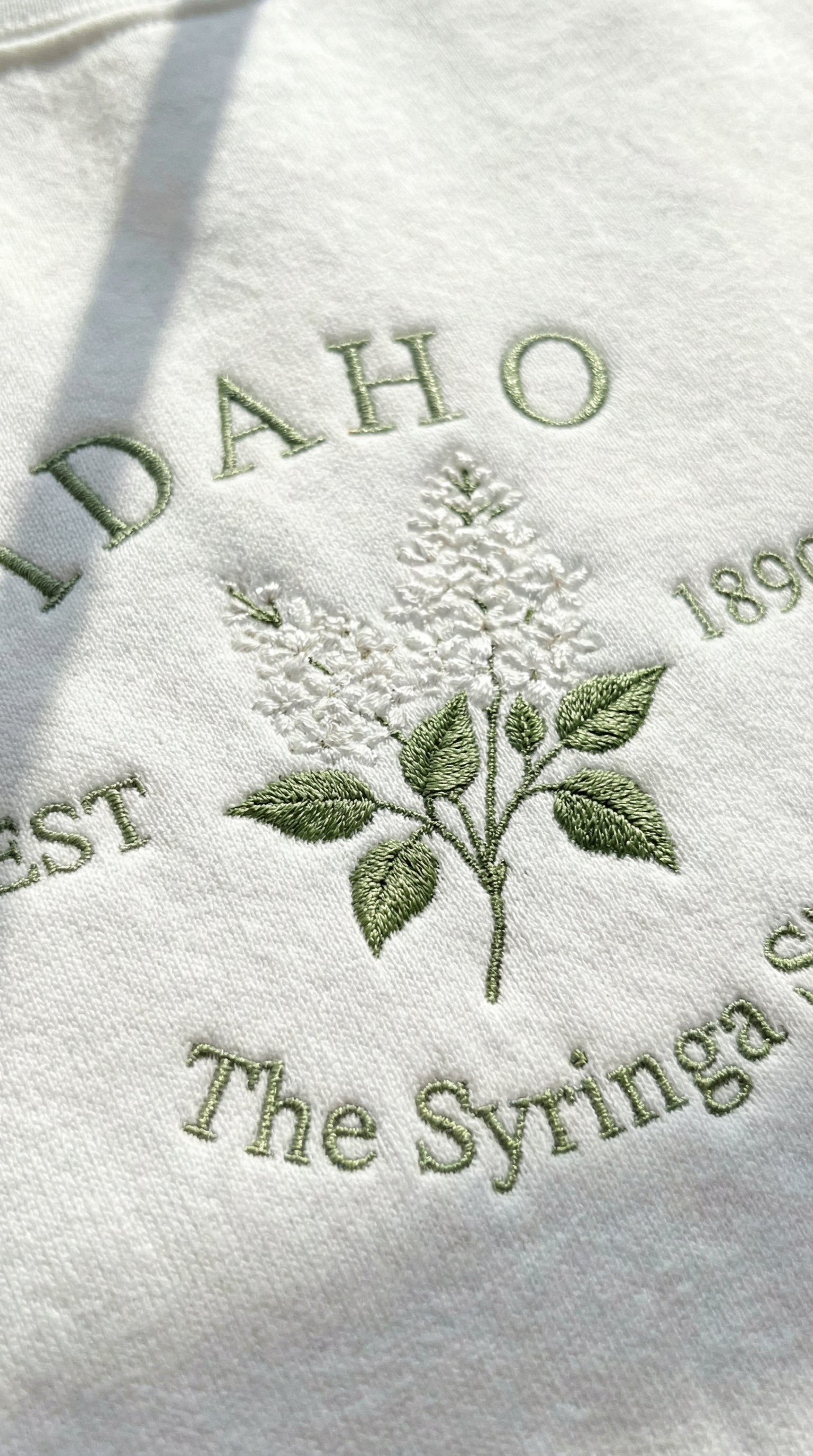 Idaho Syringa Embroidered Sweatshirt – White Botanical State Flower Crewneck Unisex