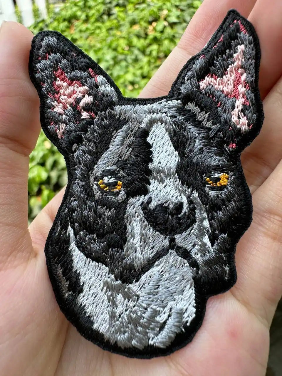 Iron-on Boston Terrier patch displayed on hoodie