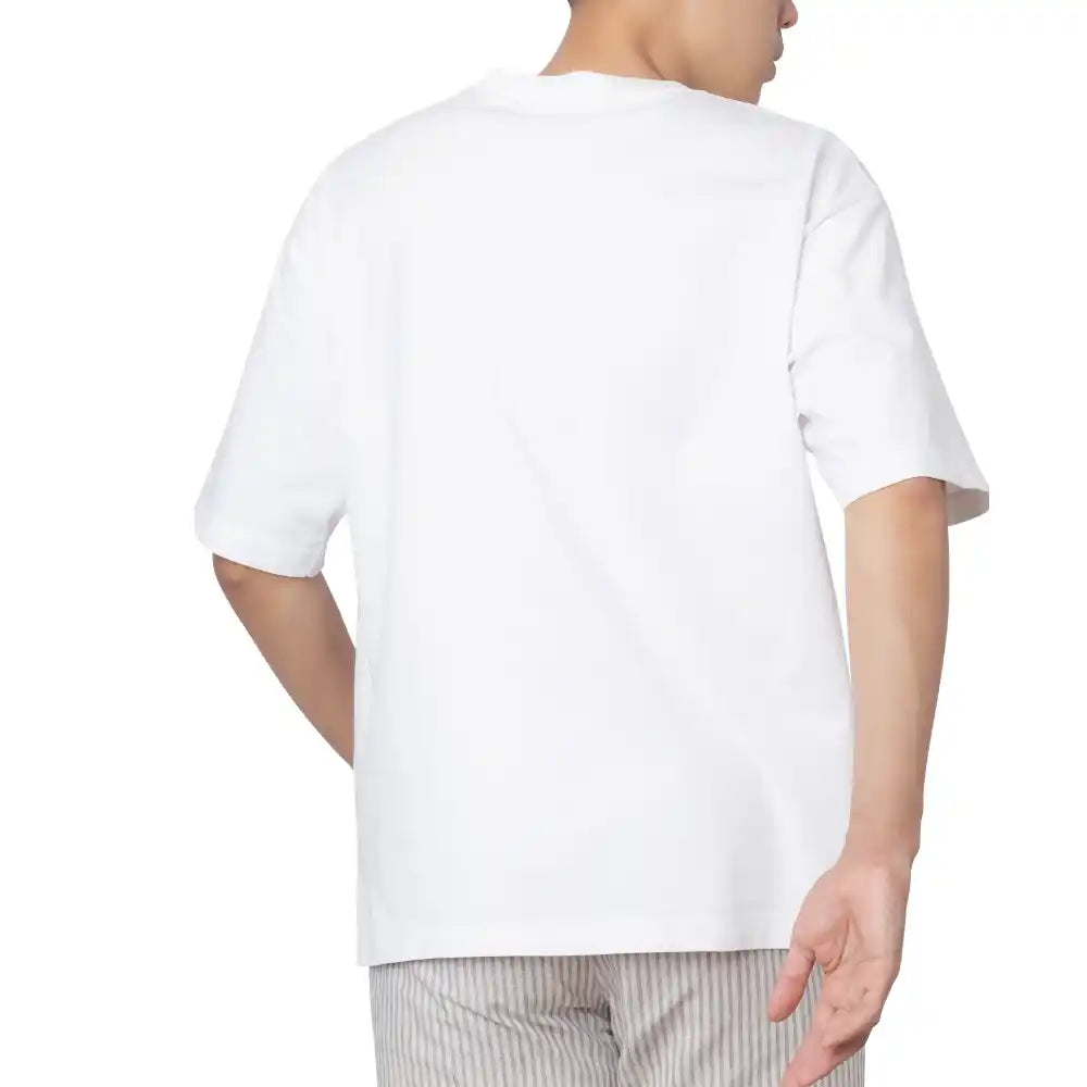 Model styling embroidered Jungkook shirt with jeans