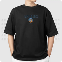 Model wearing Arches embroidered shirt in desert setting