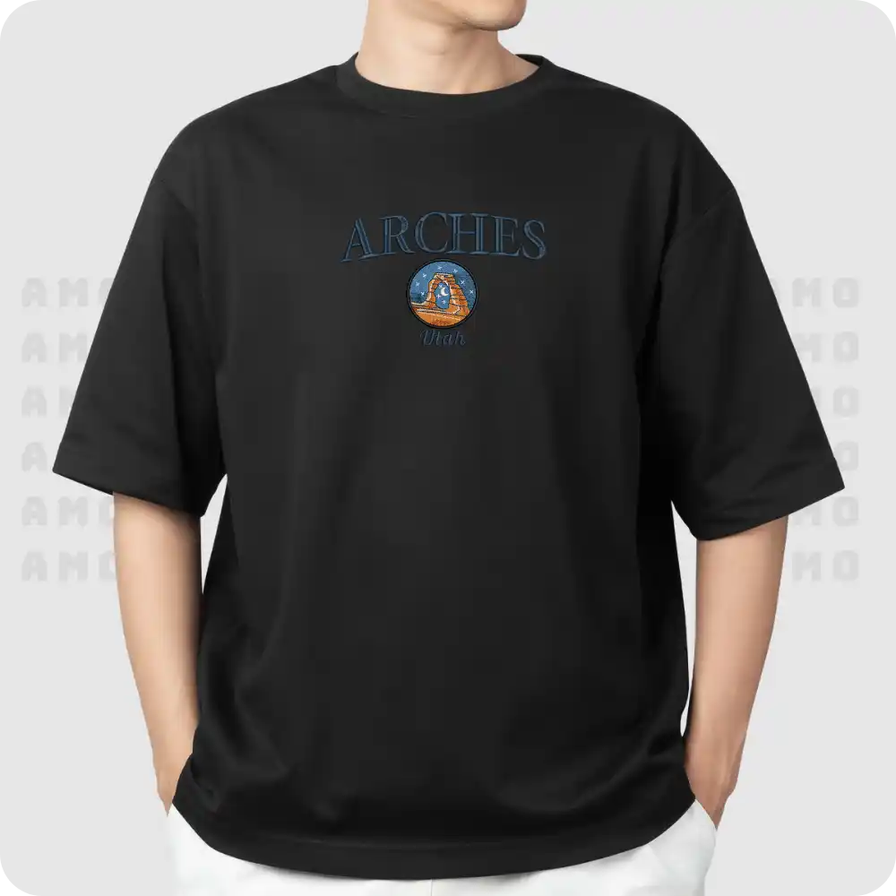 Model wearing Arches embroidered shirt in desert setting