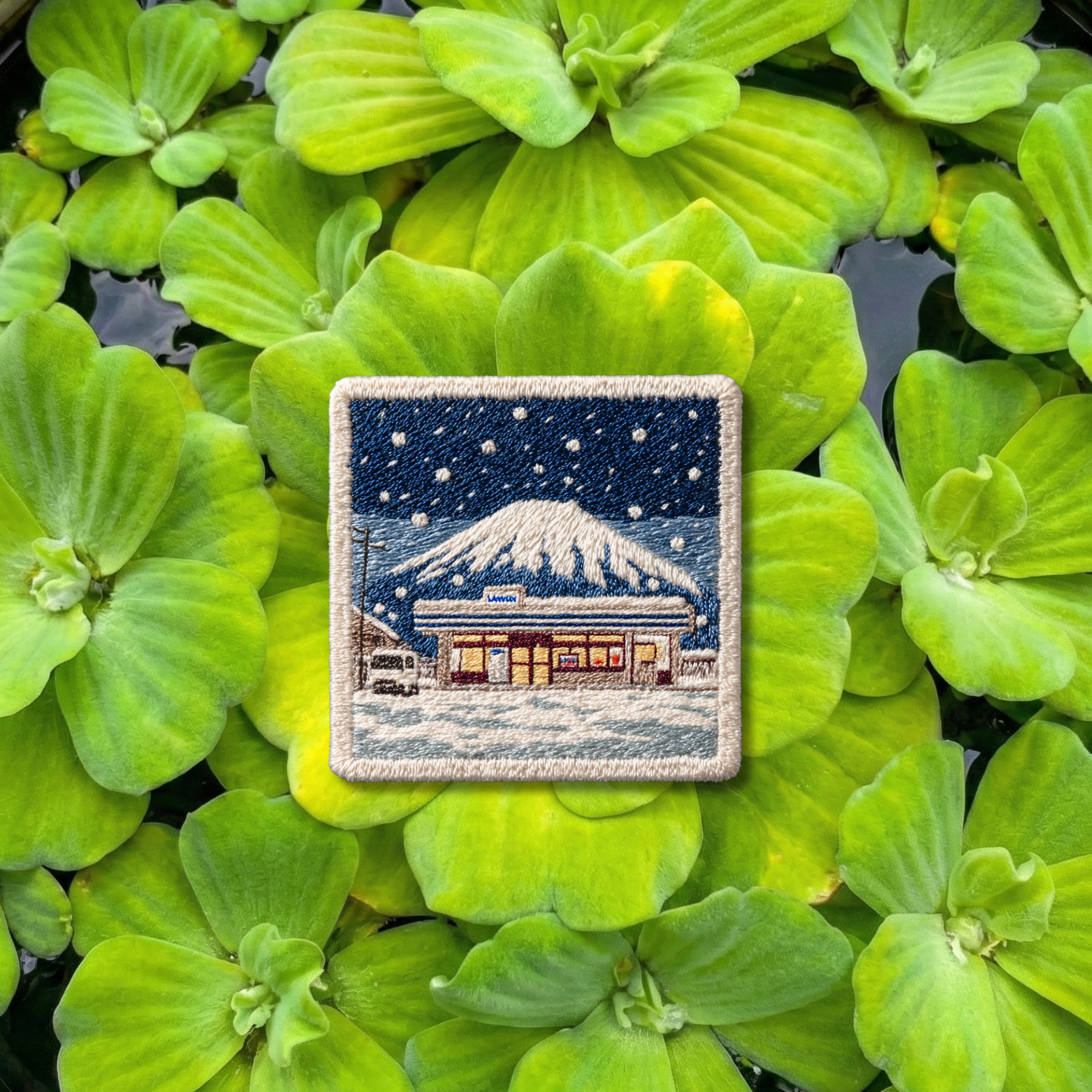 Mount Fuji winter embroidery patch with snowy night scene and roadside gas station in Japan
