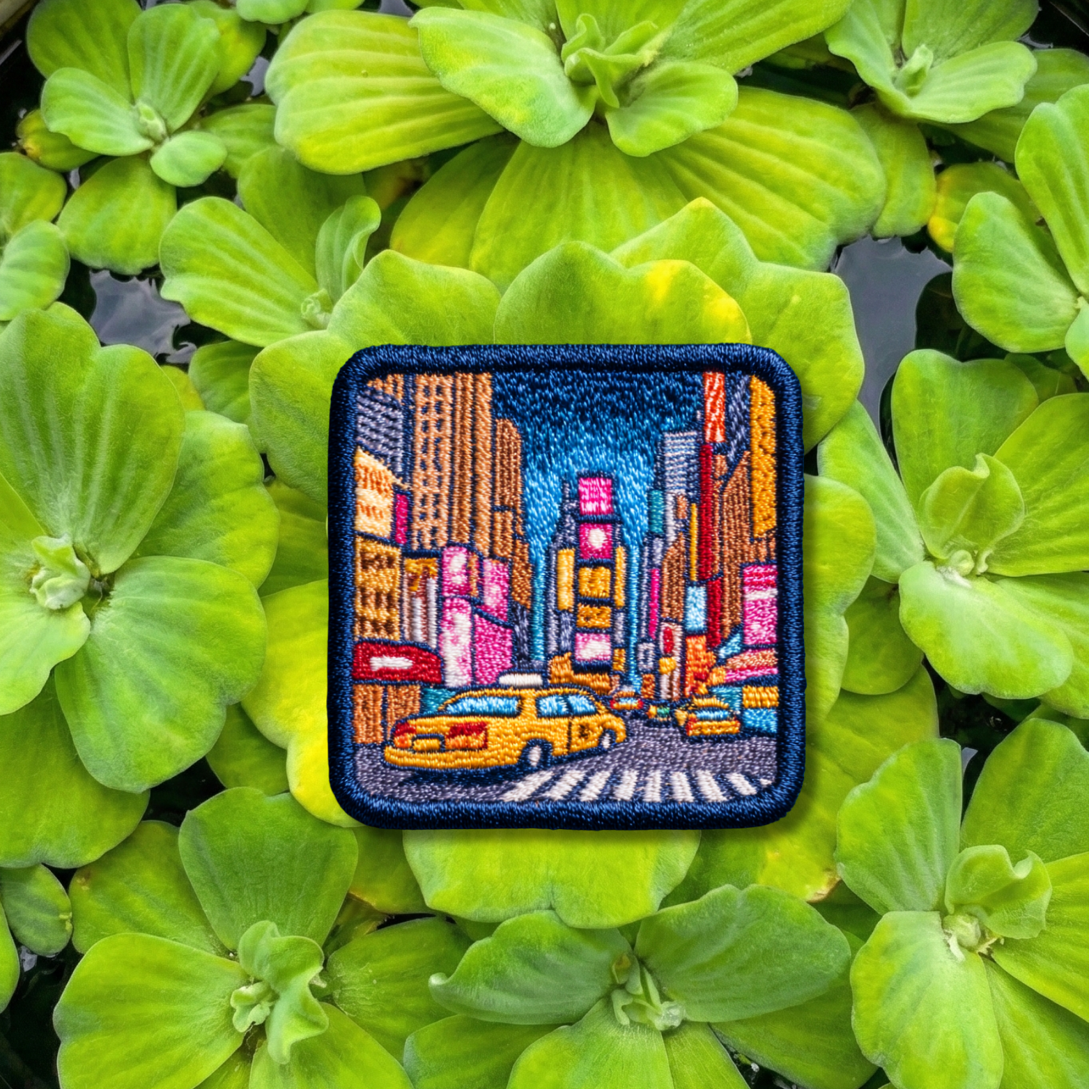 New York City travel embroidery patch featuring Times Square skyline and yellow taxi
