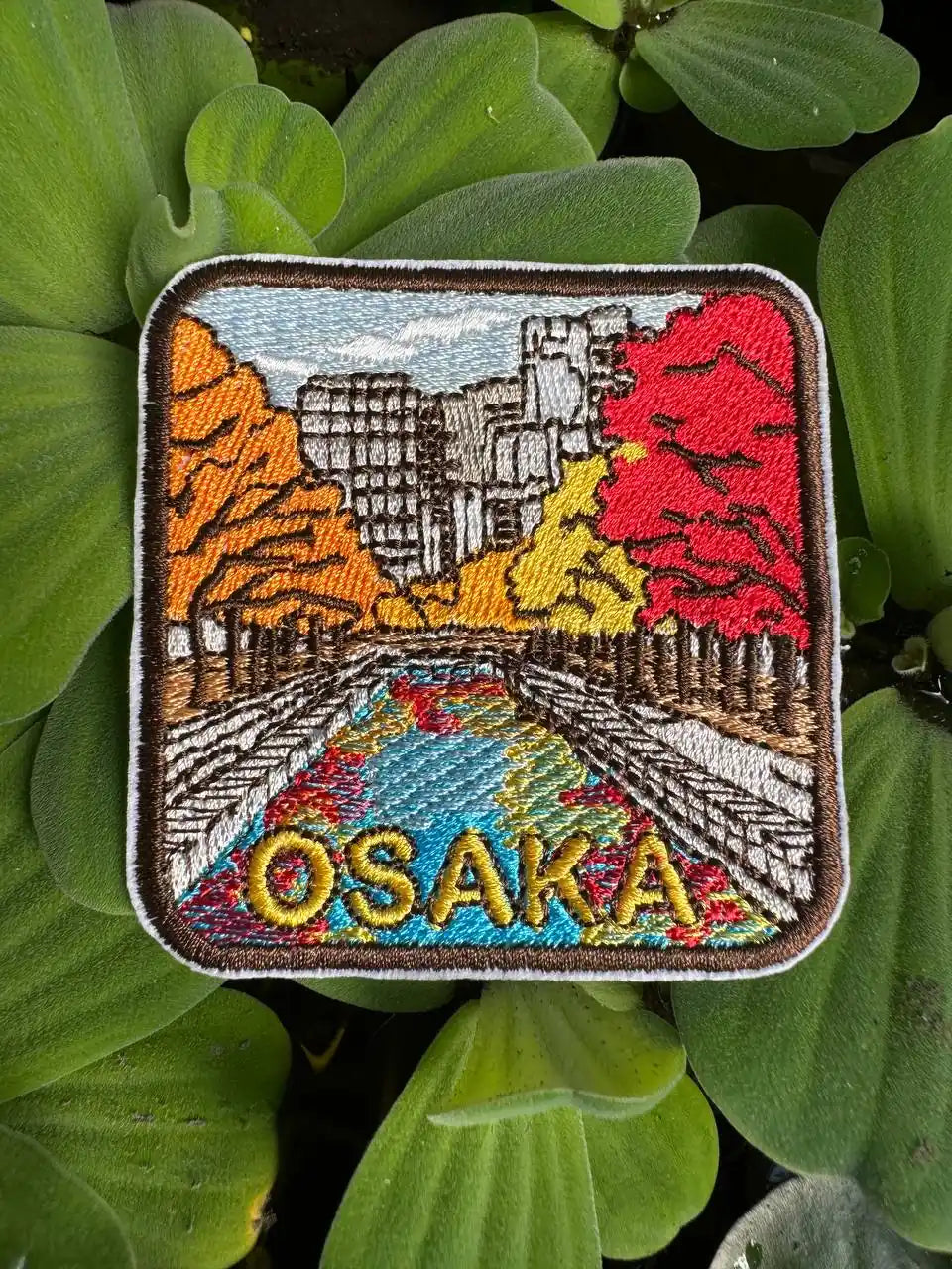 Osaka embroidered patch with autumn leaves and riverside view – Japan souvenir