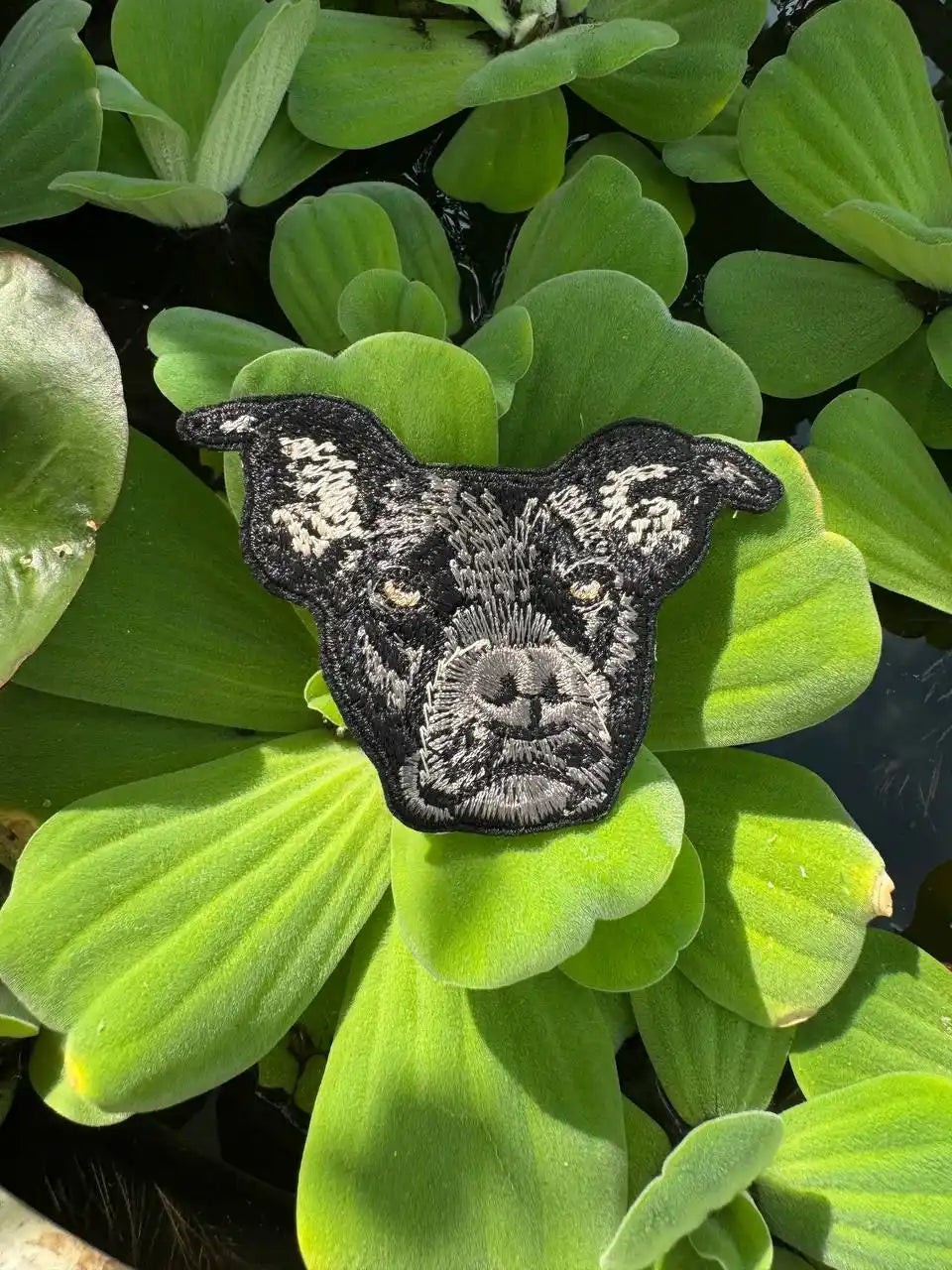 Close-up of embroidered dog face patch