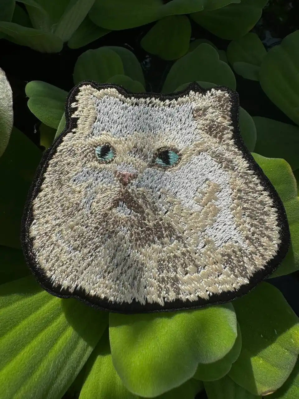 Persian Cat embroidered portrait patch on denim jacket

