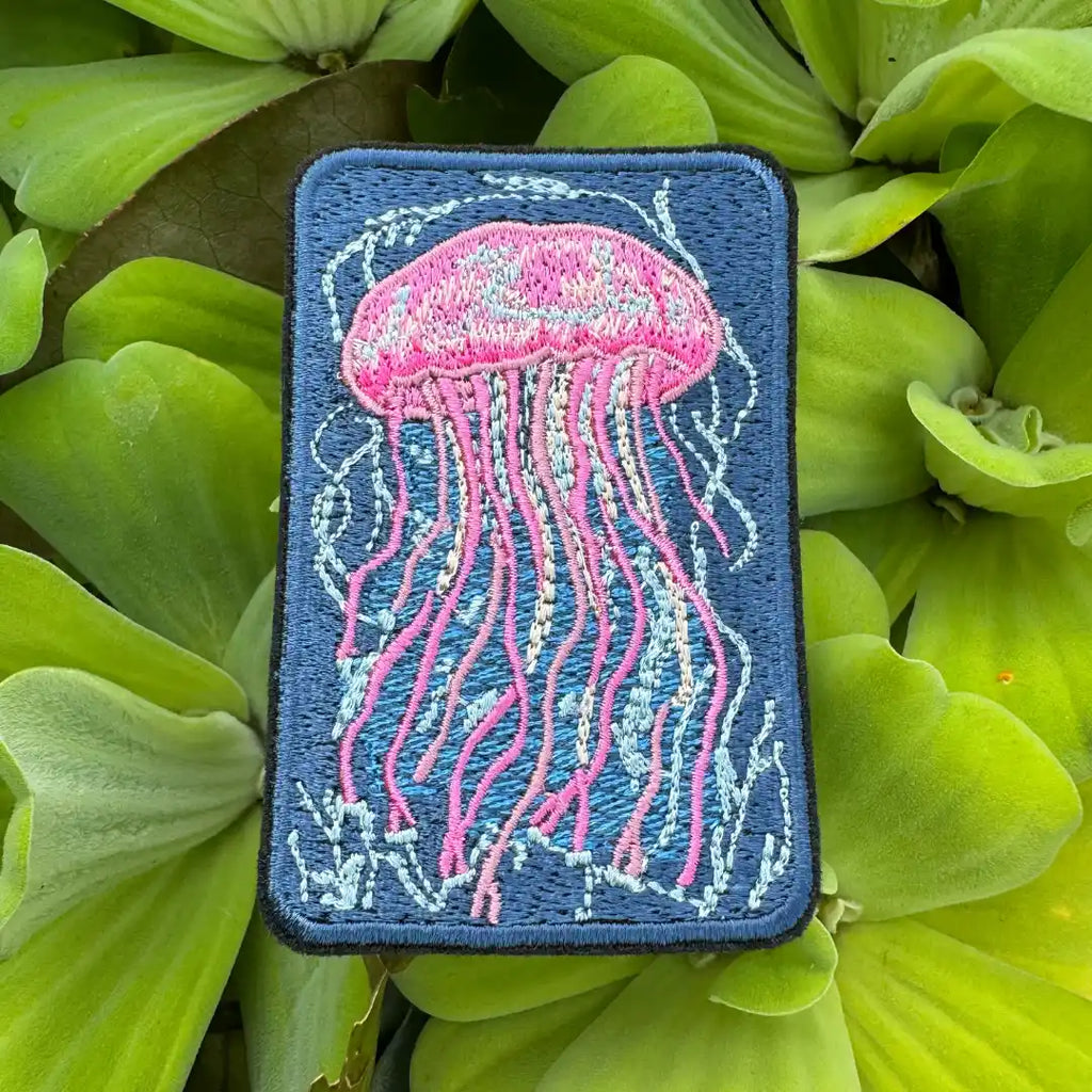 Whimsical marine jellyfish appliqué in pink and blue