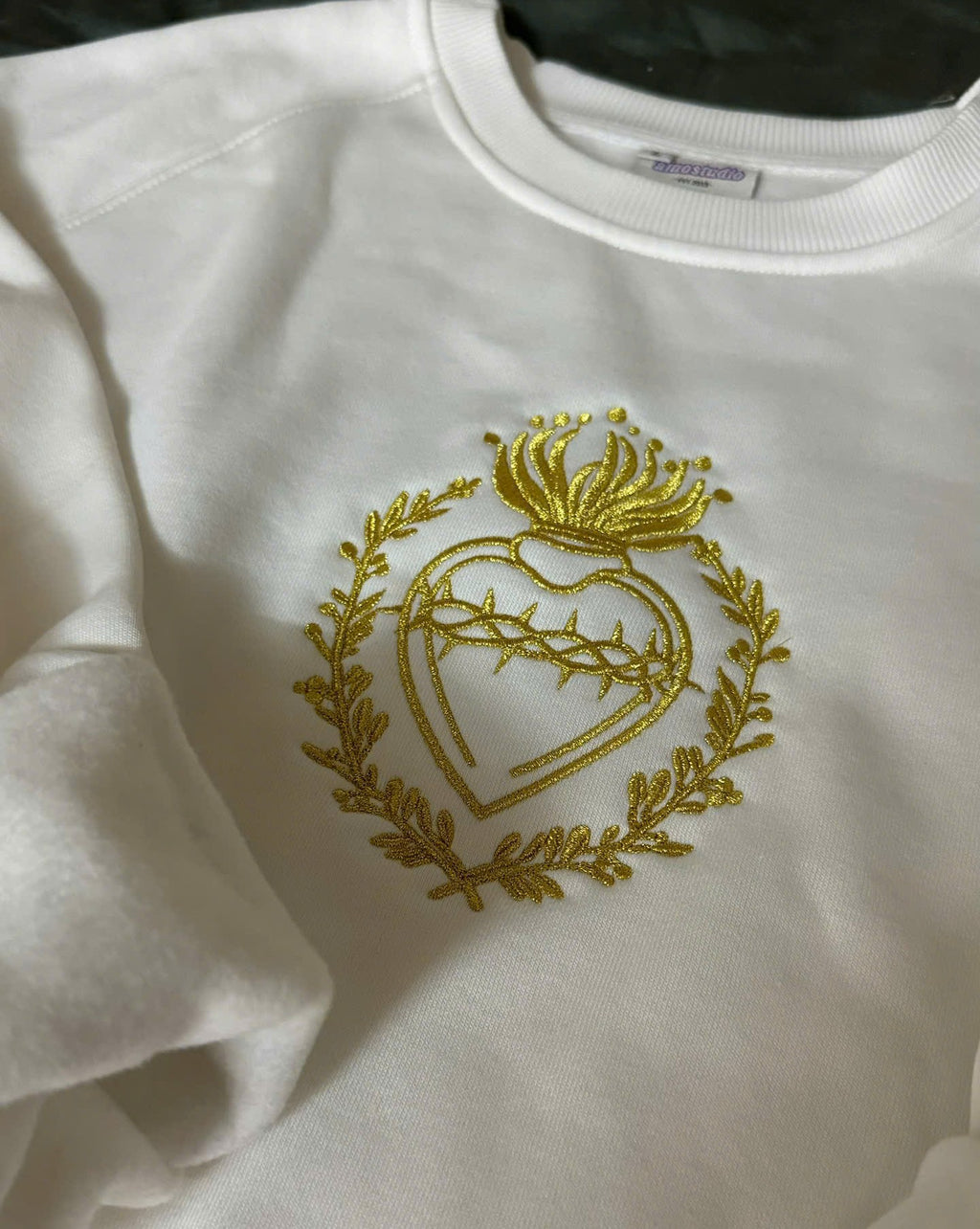 catholic sacred heart embroidered sweater close up