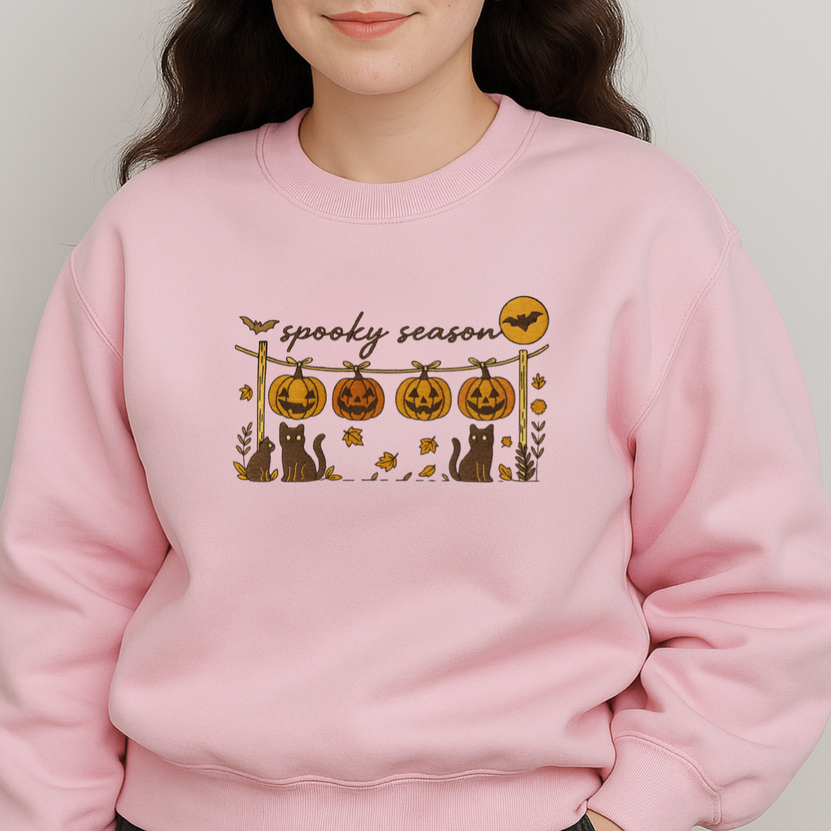 close-up embroidery pumpkins cats and bats design