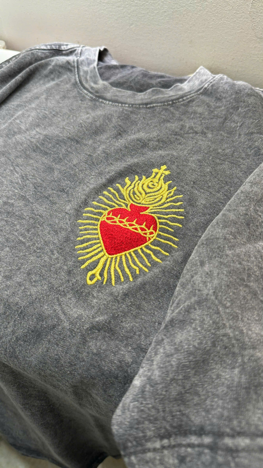 close-up sacred heart embroidery detail