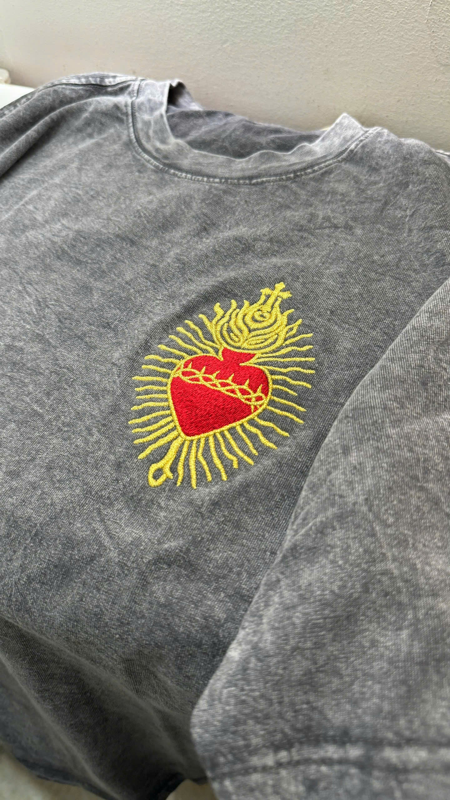 close-up sacred heart embroidery detail