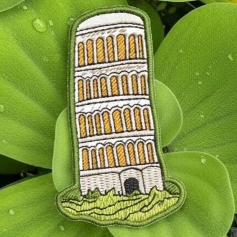 leaning tower of pisa embroidered travel patch on green leaves