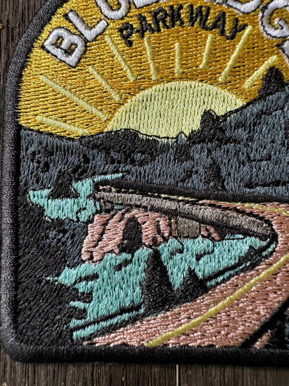iron-on blue ridge parkway patch on denim jacket